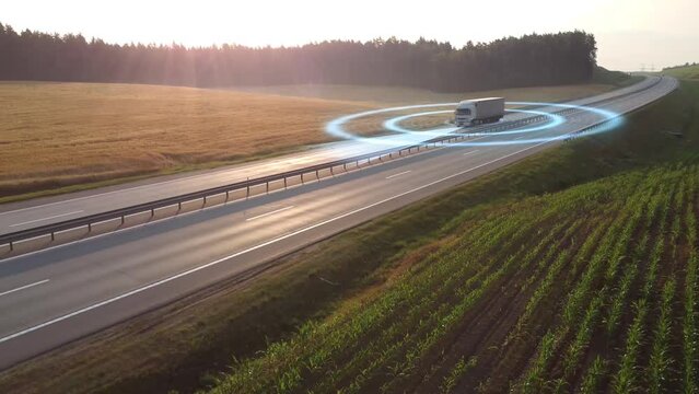 The autonomous delivery truck is seen travelling down the highway in this aerial picture.
