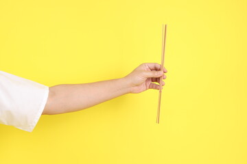 hand holding incense sticks