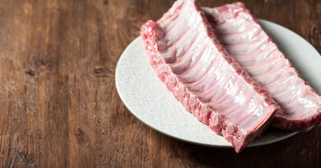 Raw back ribs on a plate