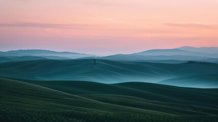 A simple view of rolling hills under a pastel sunset