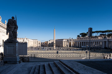 View of Saint Peter's Square in Vatican City, the papal enclave in Rome, from St. Peter's Basilica. - obrazy, fototapety, plakaty
