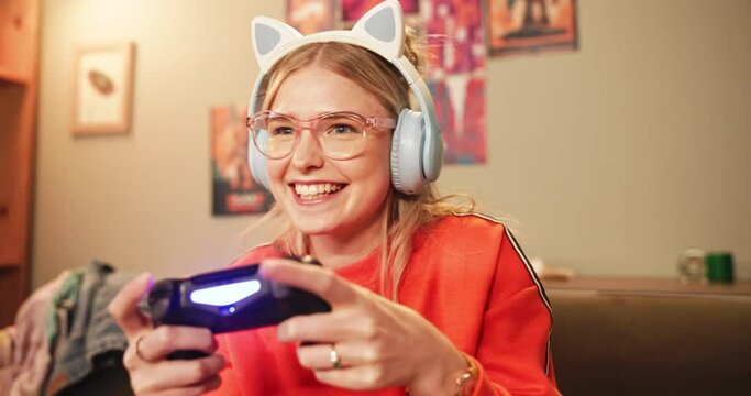 Fun, gen z gamer or controller to play, video game or esports on sofa as excited, virtual challenge. Intense, young woman or couch on tech to focus, solve or level up in online gaming competition