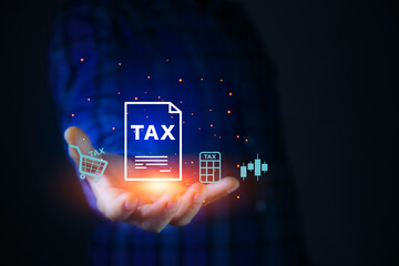 Tax increase concept. tax icon in hand. increasing taxes, Pay online income tax. income tax system icon around. futuristic virtual screen interface technology..