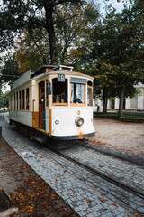 Street view with the famous retro tourist streetcar tram in the old town of Porto, Portugal. Traditional Tram - 788958327