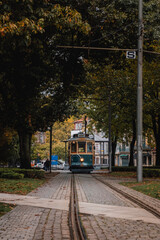 Street view with the famous retro tourist streetcar tram in the old town of Porto, Portugal. Traditional Tram - 788958359