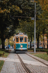 Street view with the famous retro tourist streetcar tram in the old town of Porto, Portugal. Traditional Tram - 788958391