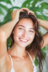 Radiant Young Woman Smiling Under Green Leaves in Daylight