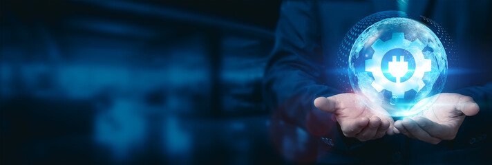 Businessman holds a global energy technology globe with a network connected to various regions and industries, utilizing advanced energy technology to foster sustainable business development.