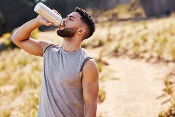 Man, drinking or water in nature or runner with bottle, workout or exercise for health. Male...