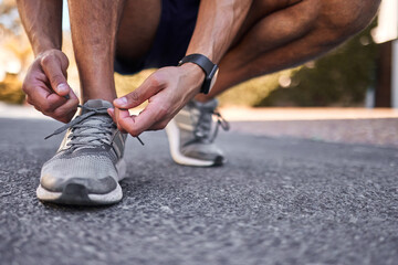 Athlete, shoelaces and hands for man runner, workout and nature for cardio exercise. Legs, footwear...