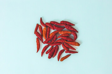 Spicy Heap, Top view Red Chili Peppers on a white background.