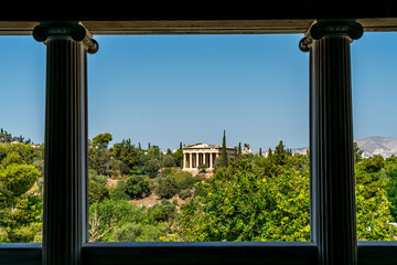 Athens, Greece. Temple of Hephaestus framed by columns. Athens Agora. Summer sunny day