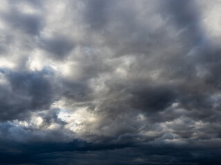 Fototapeta na wymiar Dark blue moody sky clouds background overcast storm thunderstorm rainy weather gray