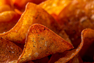 A close up of chips with salt on them.