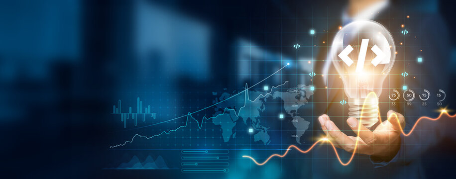Businessman holding a creative light bulb with a growth graph and innovative software development icons. Harnessing software development to create new solutions and technologies that enhance success.