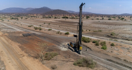 hydraulic  pile machine for drilling wells and installing piles at construction site