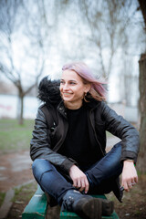 Obraz premium woman sitting on a bench in park
