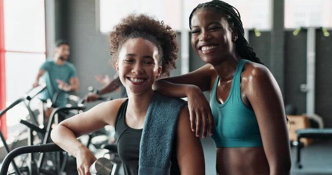 Happy, face or women on gym break laughing with fatigue, towel and wellness in fitness workout. Funny, friends sweating and exhausted athletes resting in exercise or training to relax for recovery