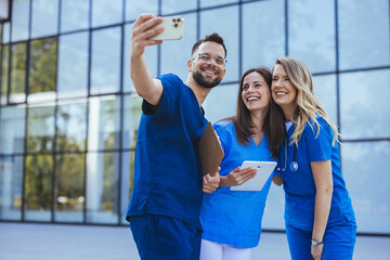 Selfie, portrait and hospital doctors, happy people or surgeon team smile on healthcare, medical photo or health services. Teamwork support, memory picture or group face of diversity medicare nurses - 789005716