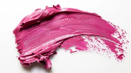 Pink satin lipstick smeared on a white background.
