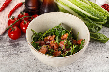Salad with salmon and arugula