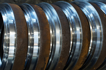 Close-up of large steel pipes at a machine-building plant. Heavy industry production process.