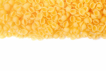 Shell shaped pasta border on white background. Copy space for text. Top view