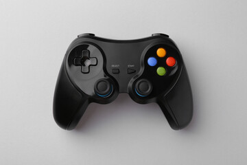 Wireless game controller on light grey background, top view © New Africa