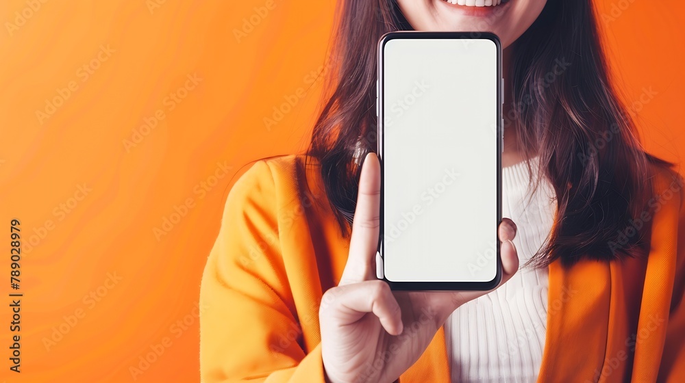 Leinwandbilder app ad smiling pretty woman holding smartphone with white blank device screen in hand close up to ca