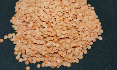 Masoor dal, Red lentils isolated on black background, Indian Dal