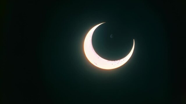 Video animation of Crescent Moon Eclipse. It&rsquo;s a beautiful celestial event where the moon is partially illuminated, creating a crescent shape against the dark night sky