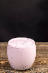 pink fermented milk drink with berry flavor