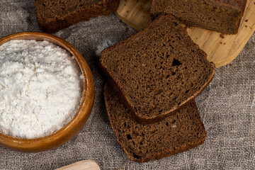 rectangular loaf of bread on a linen cloth