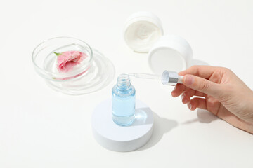 Cosmetics with chemical flasks and a flower