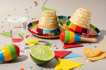 Nachos with tequila and lime on a light background