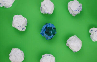 Group of Crumpled Paper on Green Background. Earth day concept.