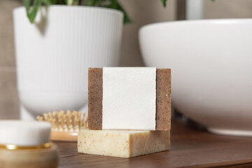 Brown Handmade  soap bar with blank label on bath wooden countertop close up, mockup