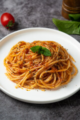 Traditional pasta spaghetti in plate on table.