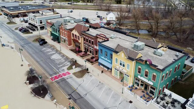 flyover of the downtown of a small beach town in the midwest (Pewaukee, WI)