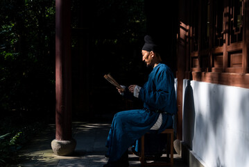 ancient person reading book