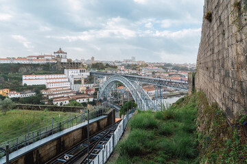 A close-up of the Dom Luís I Bridge in the old town of Ribeira, Porto, Portugal. Fragment of a metal railway bridge between Oporto and Nova Gaia