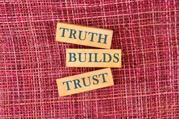 Truth builds trust symbol. Concept words Truth builds trust made up of wooden blocks