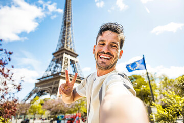 Happy tourist taking selfie picture in front of Eiffel Tower in Paris, France - Travel and summer vacation life style concept - 789068945