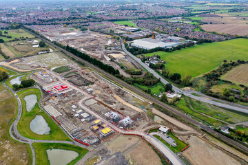 Aerial photo of a construction building site building houses, taken in Leeds in the UK showing a housing development with houses being built.