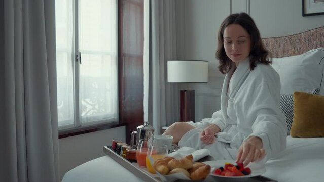 Woman Enjoying Breakfast in Bed