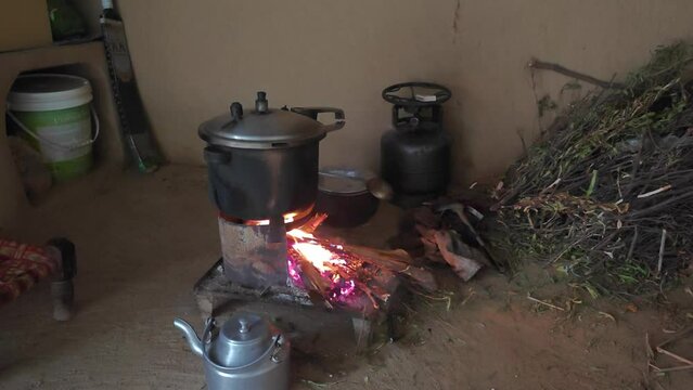Pressure cooker on wooden stove in a traditional vintage kitchen