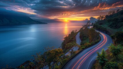 Sunset over a scenic lake road