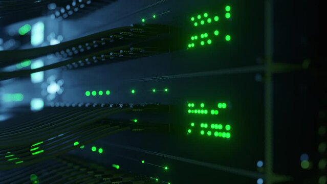 Close-up view of modern internet network switch with plugged ethernet cables. Blinking lights on internet server. Concept of big data center mining. Cloud computing and telecommunications