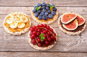 Rice cake with banana  blueberry redcurrant and figs