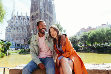 Multiracial beautiful happy couple of lovers dating in Barcelona - obrazy, fototapety, plakaty